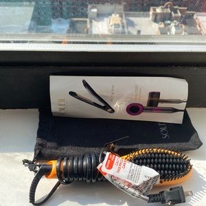 Travel size heated hairbrush by Soleil